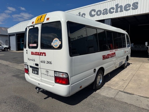 
								2009 Toyota Coaster Deluxe manual 19 passenger wheelchair lift equipped bus full									