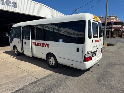 
								2009 Toyota Coaster Deluxe manual 19 passenger wheelchair lift equipped bus full									
